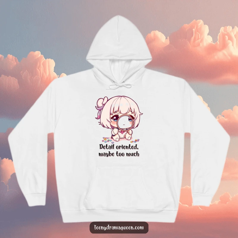 Funny hoodie depicting a character using a miniature magnifying glass to scrutinize a single, misplaced sequin with great intensity.