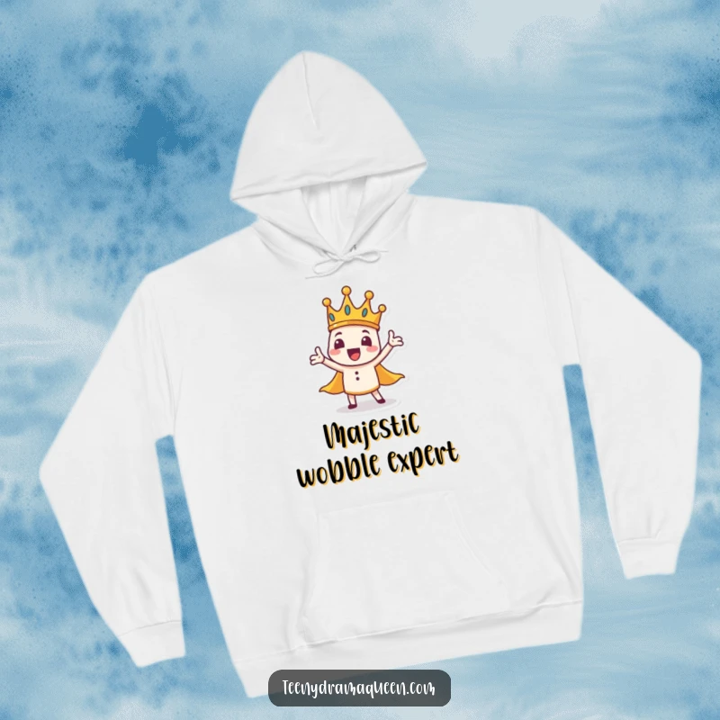 Funny crown character hoodie, tiny, wobbly base, dramatic gesture, embodying regal humor in cozy attire.