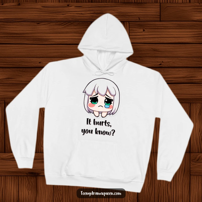 Funny hoodie, an exaggeratedly sad character with a single tear, offering comfort and humor.