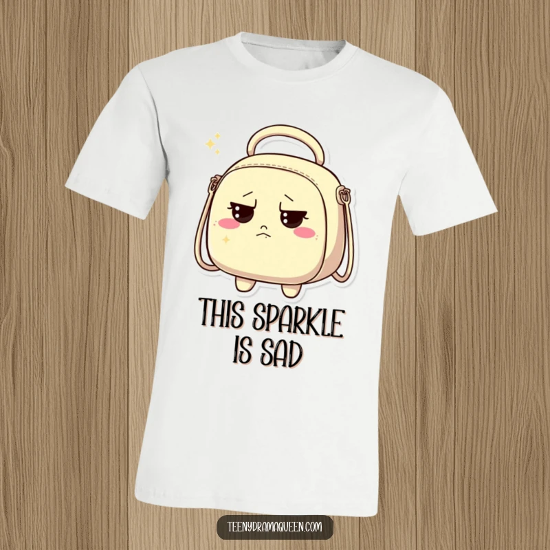 Funny t-shirt depicting a sparkly handbag character looking thoroughly unimpressed and slightly grumpy.
